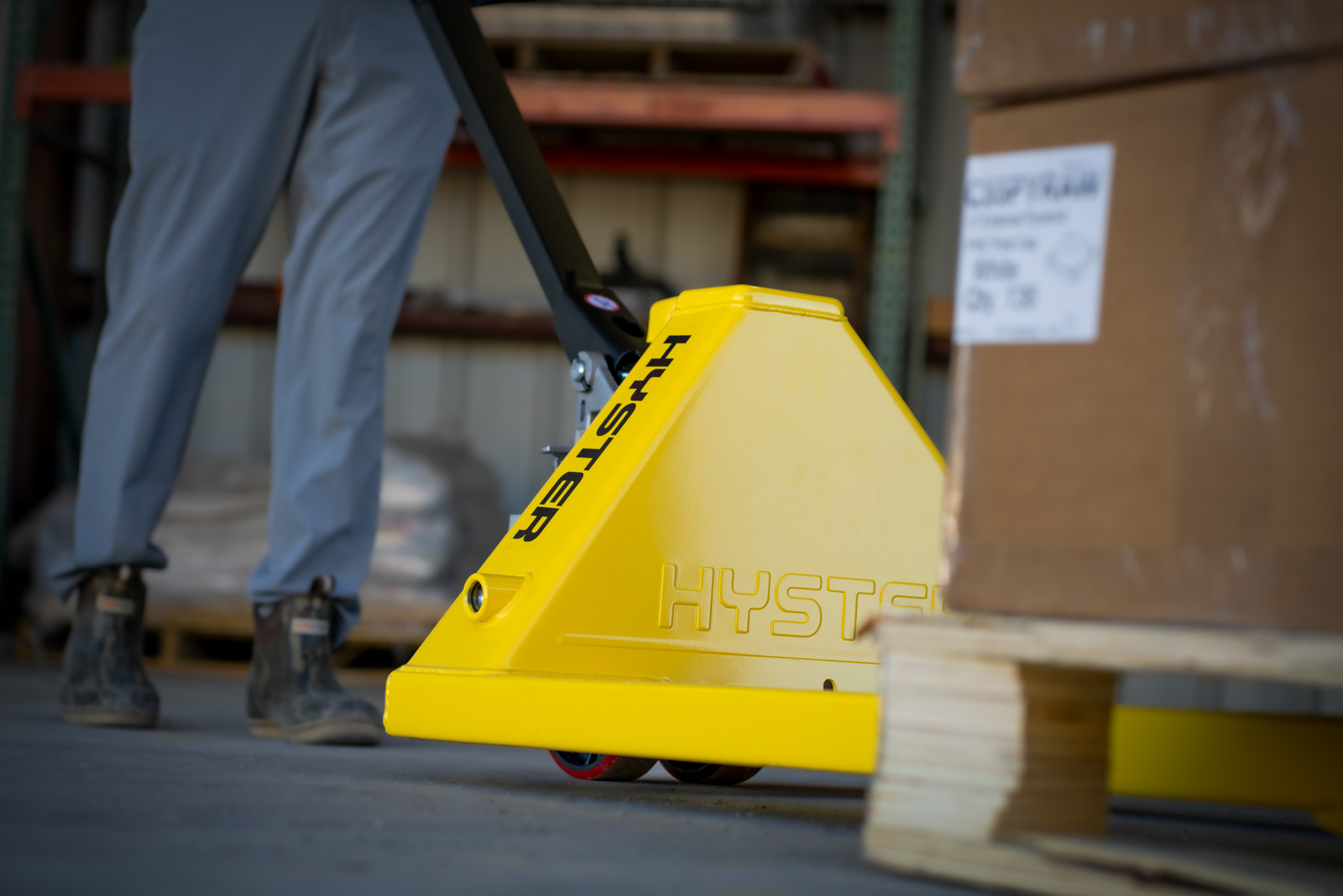 A forklift operator looks through overhead guard