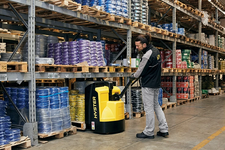 Pedestrian forklift truck at work