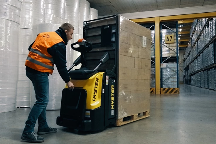 Electric pallet jack from Hyster on factory floor