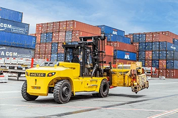 Hyster electric container handler, a type of cargo handling equipment, operating in a container yard