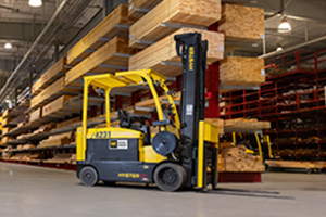 Hyster forklift in an indoor lumber yard
