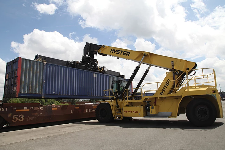 A Hyster truck moving a container