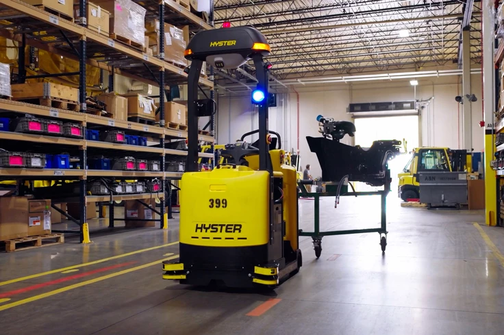 Hyster Atlas automated tugger pulling a cart
